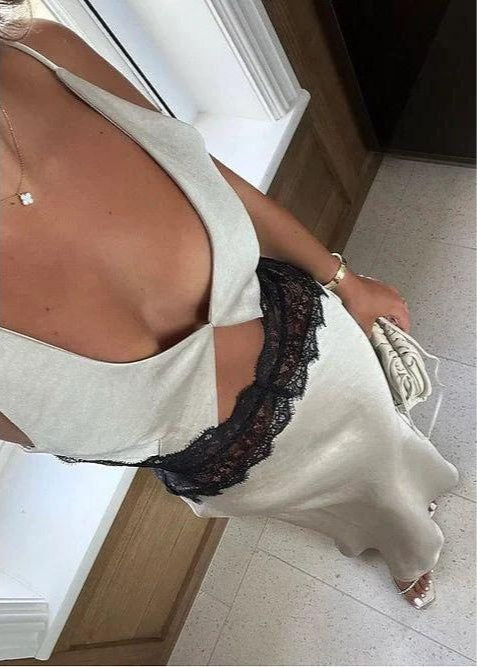 Bec and Bridge Camille Dress in Sand with black lace detailing around stomach, Size 6. Perfect for formals/balls, 21sts etc. Mainly made of polyester, nylon and rayon with a silky feel. Above angle view of dress