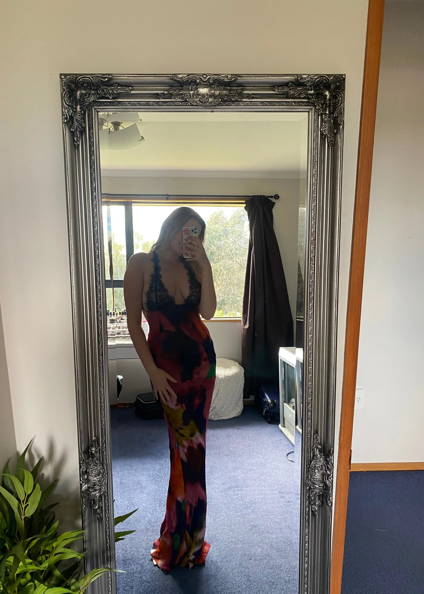 Rat and Boa Paola Maxi Slip Dress, Size L. Featuring a moody, abstract floral print and finished with delicate black lace detailing, it's a floor-skimming slip with delicate, criss-crossing straps and a daringly low-cut back. Perfect for formal events. Front on view of dress.