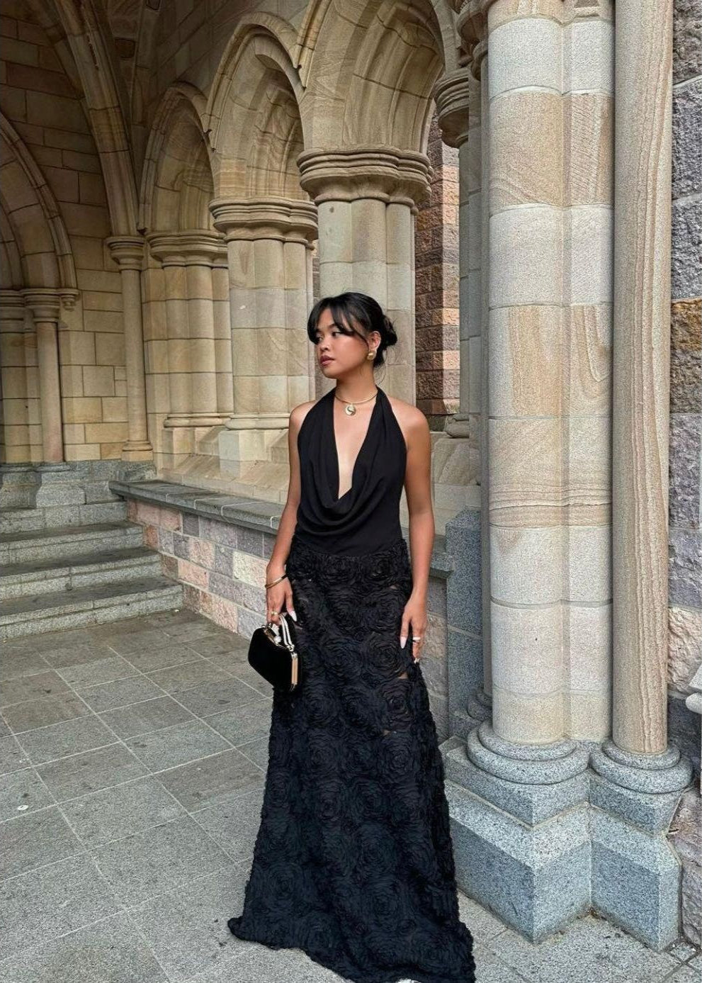 Arcina Ori Adriana Dress in Black, Size M. Low draping front that's is adjustable. Open back with one small strap to connect top area. Skirt flower patterned and is semi sheer. Front view of dress