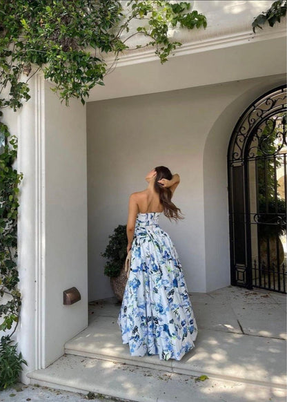 Aje Violet Bubblehem Maxi Dress in Blue Floral, Size 8. Zip up back. Side split on leg up to mid thigh. Tight fitting (with stretch) bust and torso and puffy bottom. Back view off the dress.