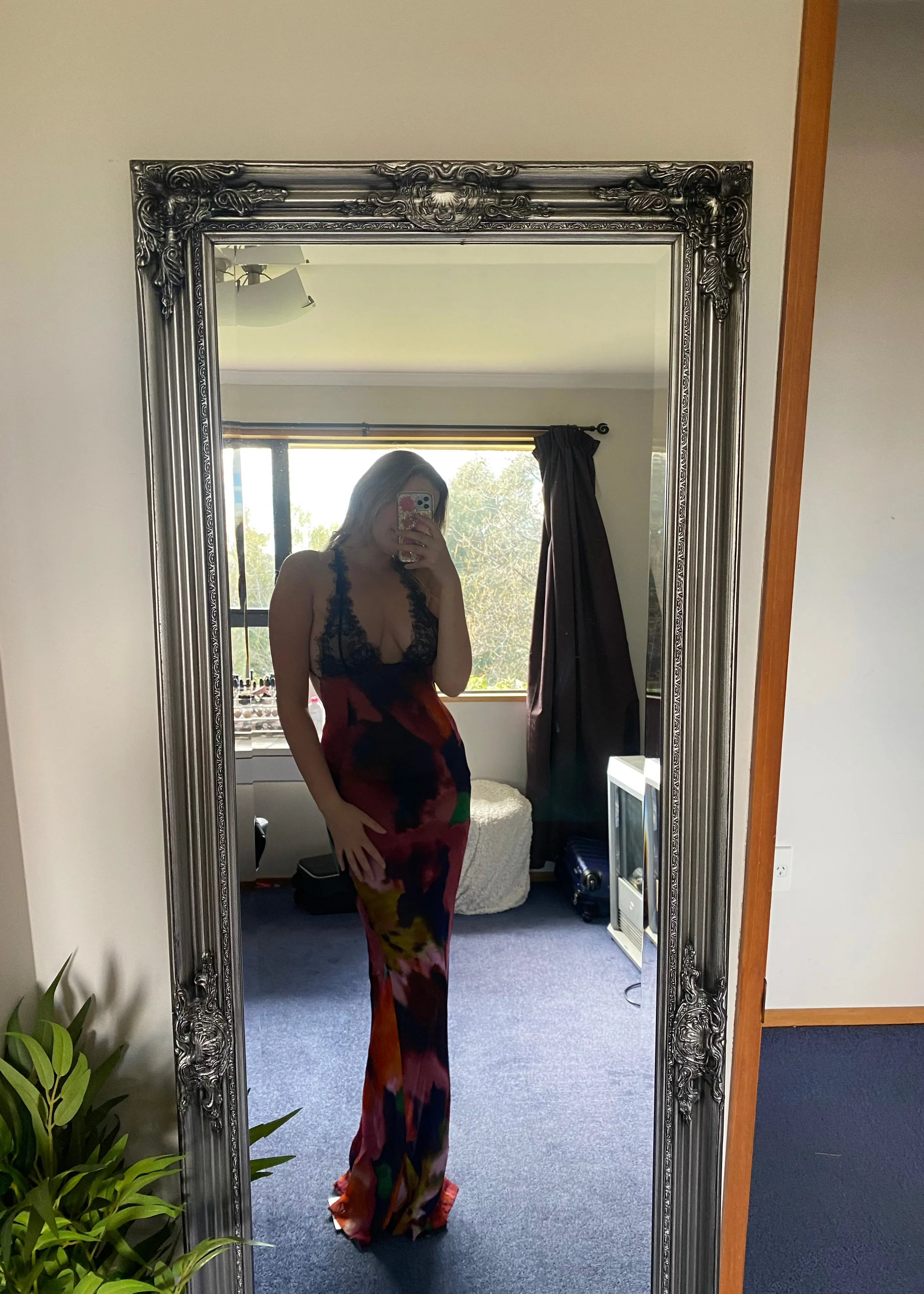 Rat and Boa Paola Maxi Slip Dress, Size L. Featuring a moody, abstract floral print and finished with delicate black lace detailing, it's a floor-skimming slip with delicate, criss-crossing straps and a daringly low-cut back. Perfect for formal events. Front on view of dress.