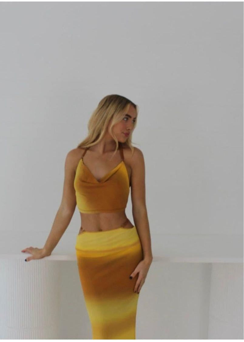 Bec and Bridge Amara Set in Ombre Yellow/Mustard, Size 6.  Adjustable top at back and skirt with zip. Perfect for summer events with a semi tight fit and breathable fabric. Front on view of set not full length picture ends around knee height