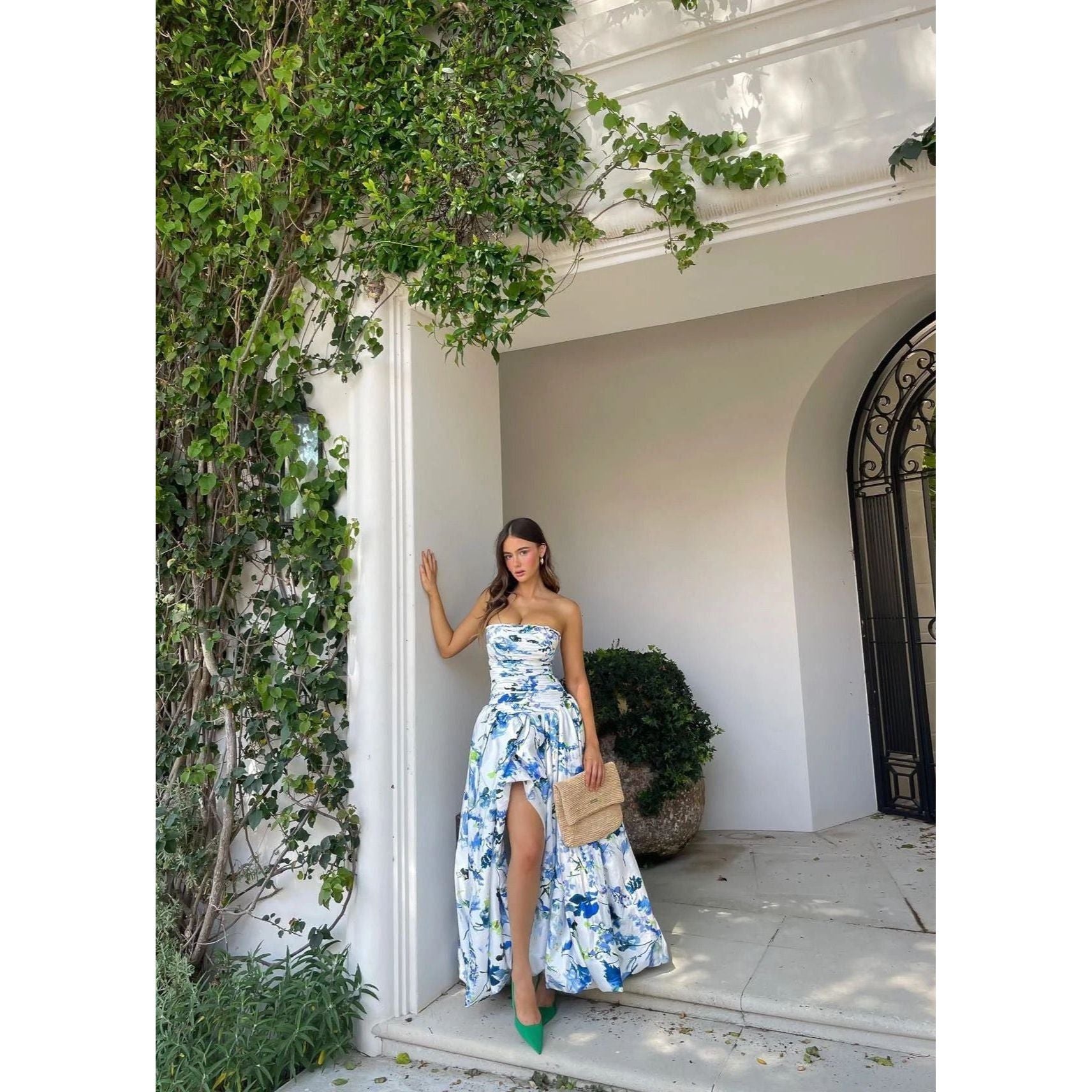 Aje Violet Bubblehem Maxi Dress in Blue Floral, Size 8. Zip up back. Side split on leg up to mid thigh. Tight fitting (with stretch) bust and torso and puffy bottom. Front on view off the dress.