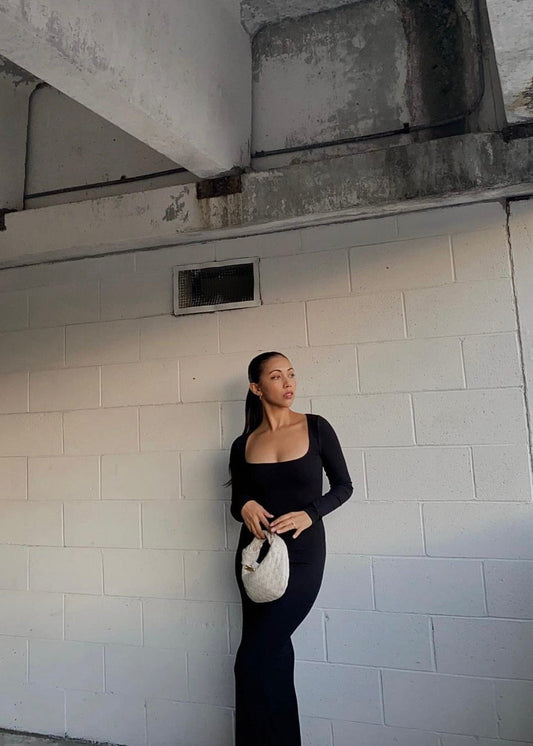 SKIMS Long Sleeve Slip Maxi Dress in Black, Size S. Featuring a Front Square Neckline, Maxi Length, Comfortable, Body-Hugging Fit, Ribbed Fabric Detail. Can be dressed up or down. Front on view of dress.