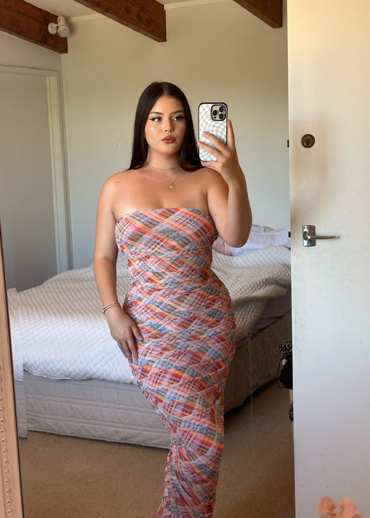 Ruby Cherry Mesh Strapless Tube Dress, Size 12. Candy tartan mesh print with gathered side seams that create ruching that gently accentuate the contours of your silhouette. Perfect for races, weddings, formals, wineries etc. Front on view of dress.