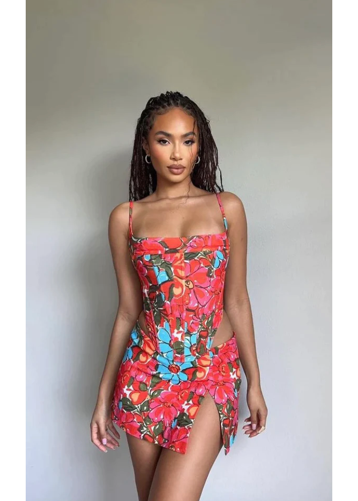 Miaou Parsian Flower Corset and Micro Mini Skirt Set, Size S. Colour scheme is pink, blue and red mostly. Featuring a lace up back and skirt which also has a small side split. This micro mini is very small. Top can be rented separately. Perfect for festivals, 18th's, bottomless brunch etc. Front on view of set.