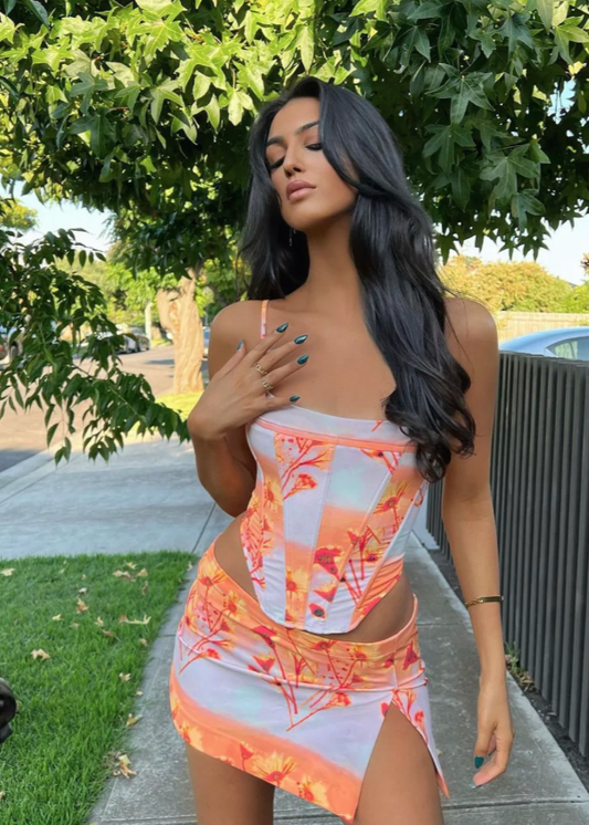 Miaou Sunrise Corset and Micro Mini Skirt Set, Size XS top ONLY and M Set. Colour scheme is cloud colour with orange and a hint of red. mostly. Featuring a lace up back and skirt which also has a small side split. This micro mini is very small. Top can be rented separately. Perfect for festivals, 18th's, bottomless brunch etc. Front on full view of set.