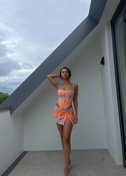 Miaou Sunrise Corset and Micro Mini Skirt Set, Size XS top ONLY and M Set. Colour scheme is cloud colour with orange and a hint of red. mostly. Featuring a lace up back and skirt which also has a small side split. This micro mini is very small. Top can be rented separately. Perfect for festivals, 18th's, bottomless brunch etc. Front on full length view of set.