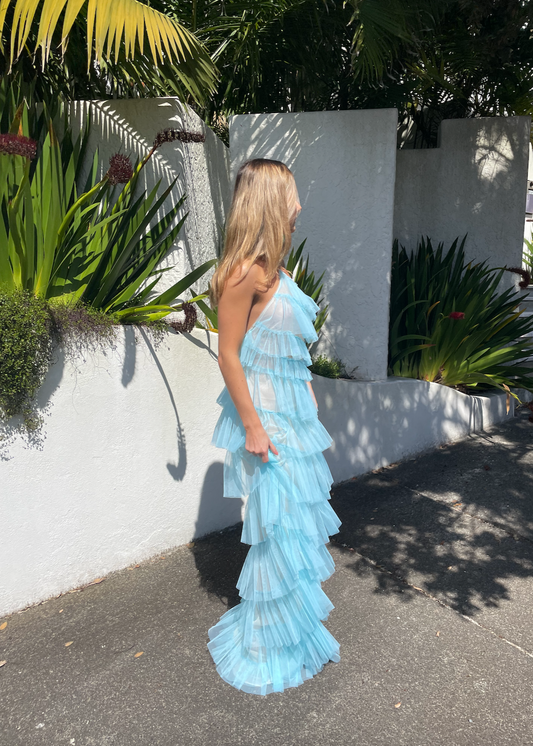 The Bar Henri Gown in Blue, Size US4 (AU8). Featuring Layered tulle fabric with a halter neck tie, side zip closure and side split, along with a low back. Semi Sheer but comes with a nude mini skirt that can be worn under. Perfect for formal events. Front side full length view.